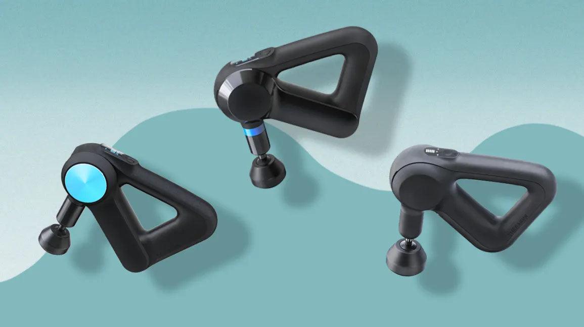 Three handheld massage guns for muscle recovery on a blue background
