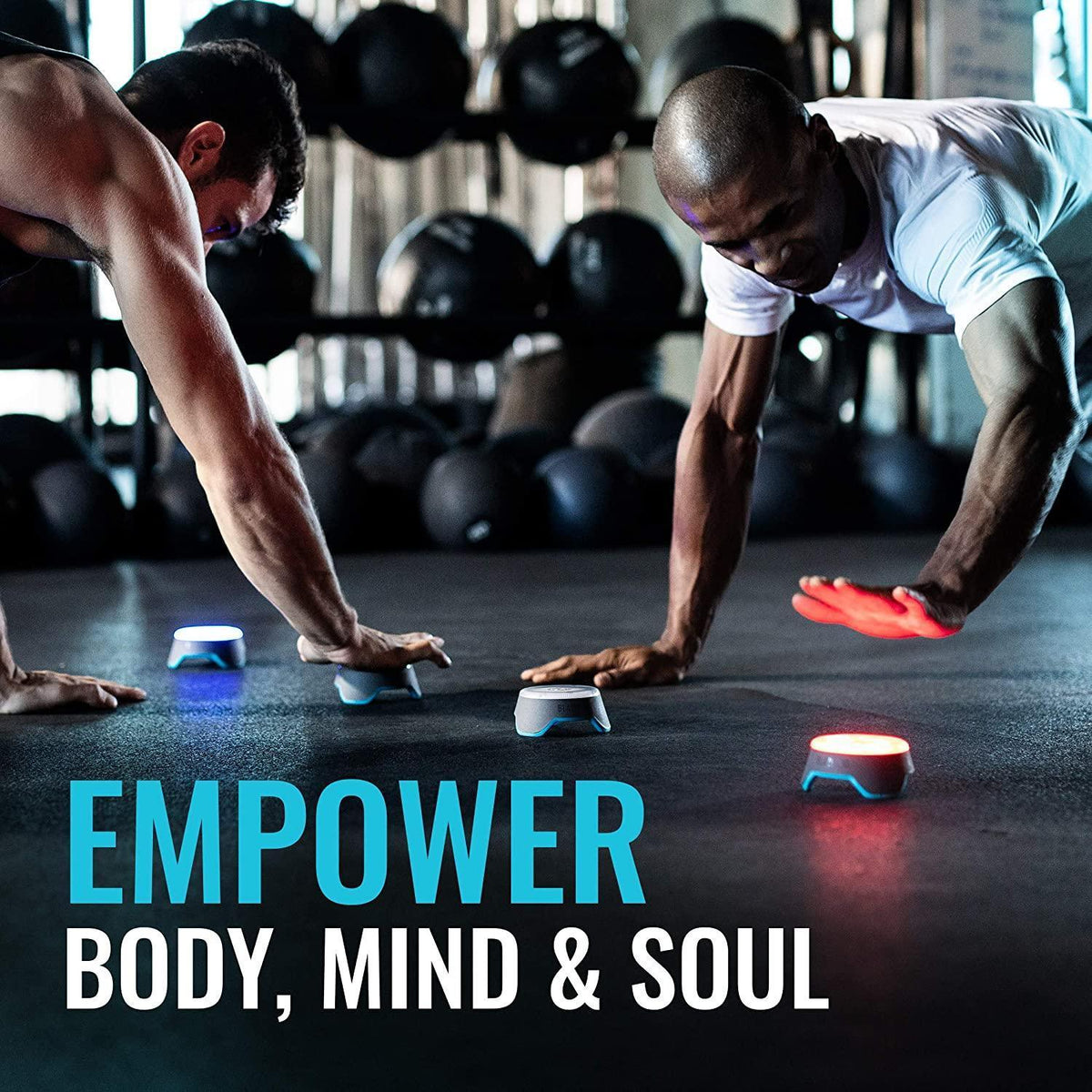 Two athletes performing functional fitness training with agility markers in a gym.