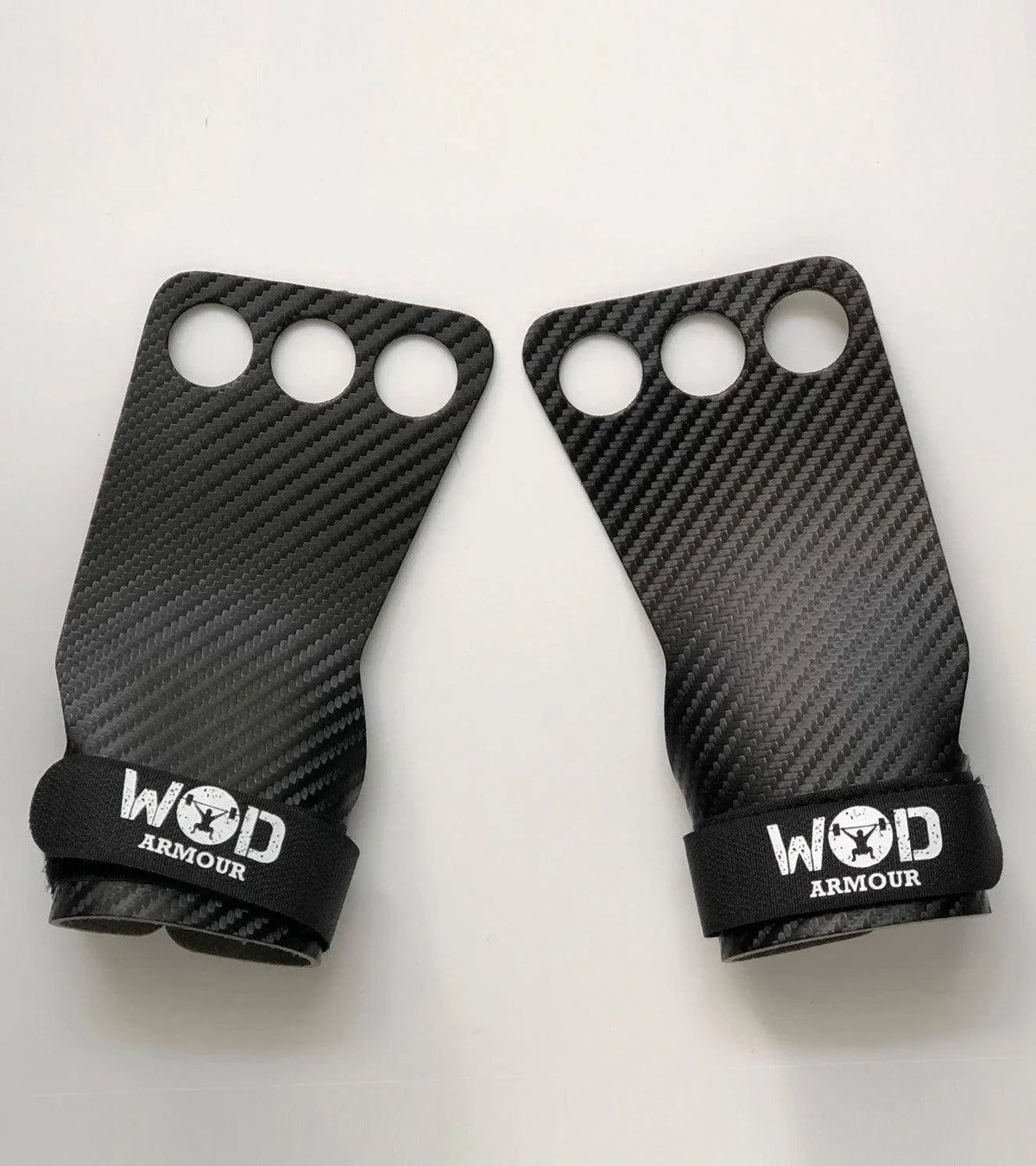 Pair of carbon fiber WOD Armour gym grips for functional fitness training