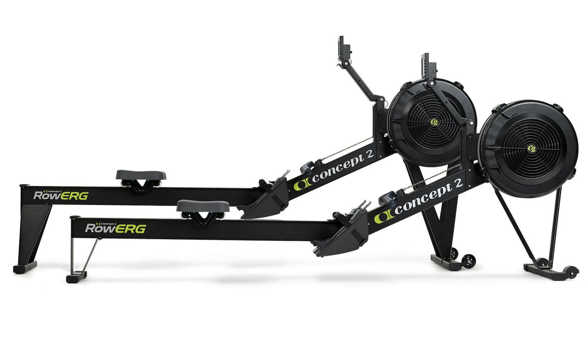 Two Concept2 RowERG indoor rowing machines side by side on a white background.