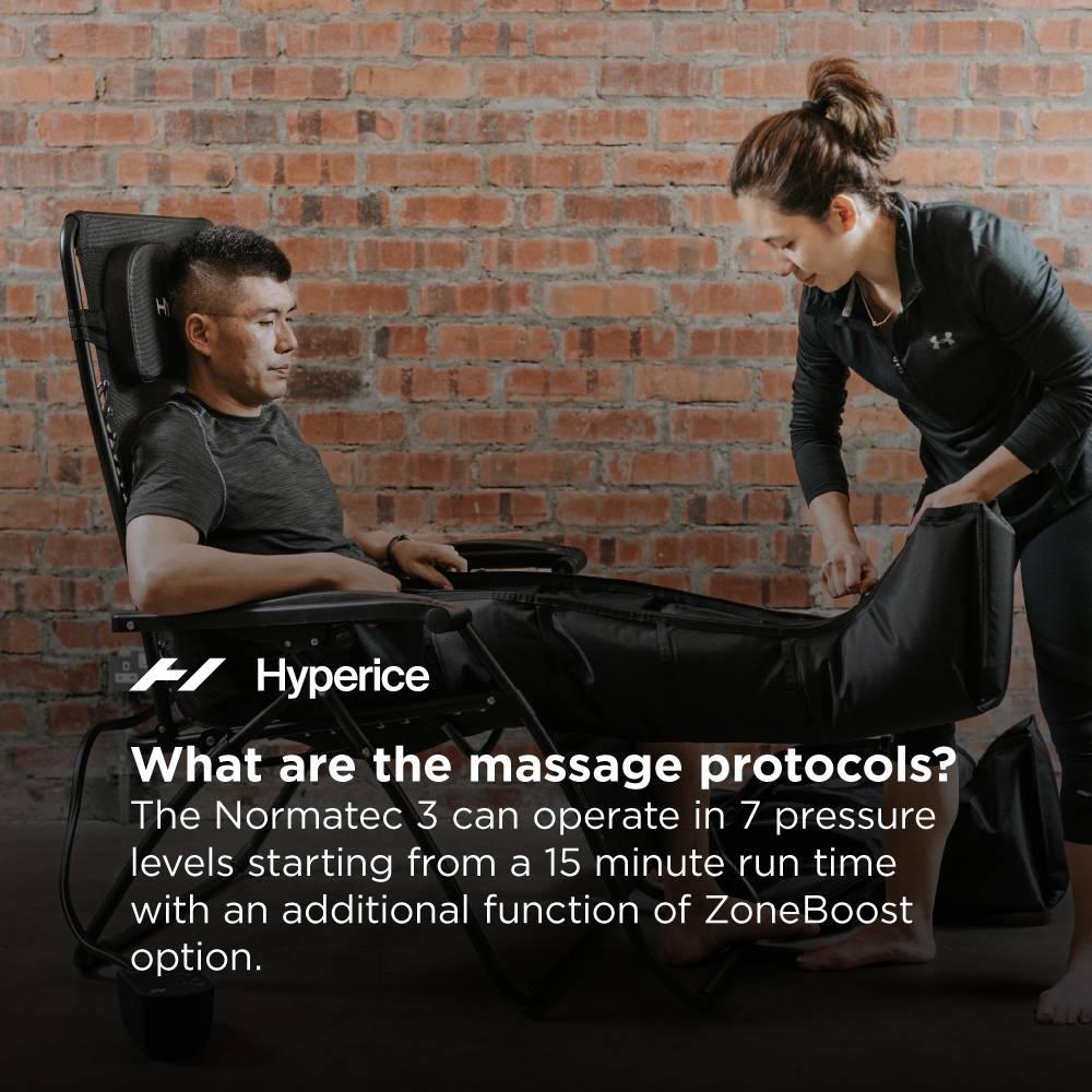 A person using a Hyperice Normatec 3 compression massage system for athletic recovery.