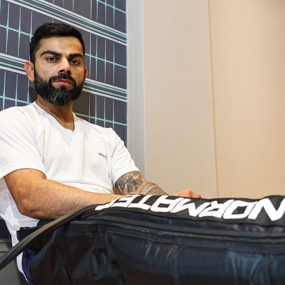 Athlete using Normatec recovery boots for muscle recovery and performance enhancement