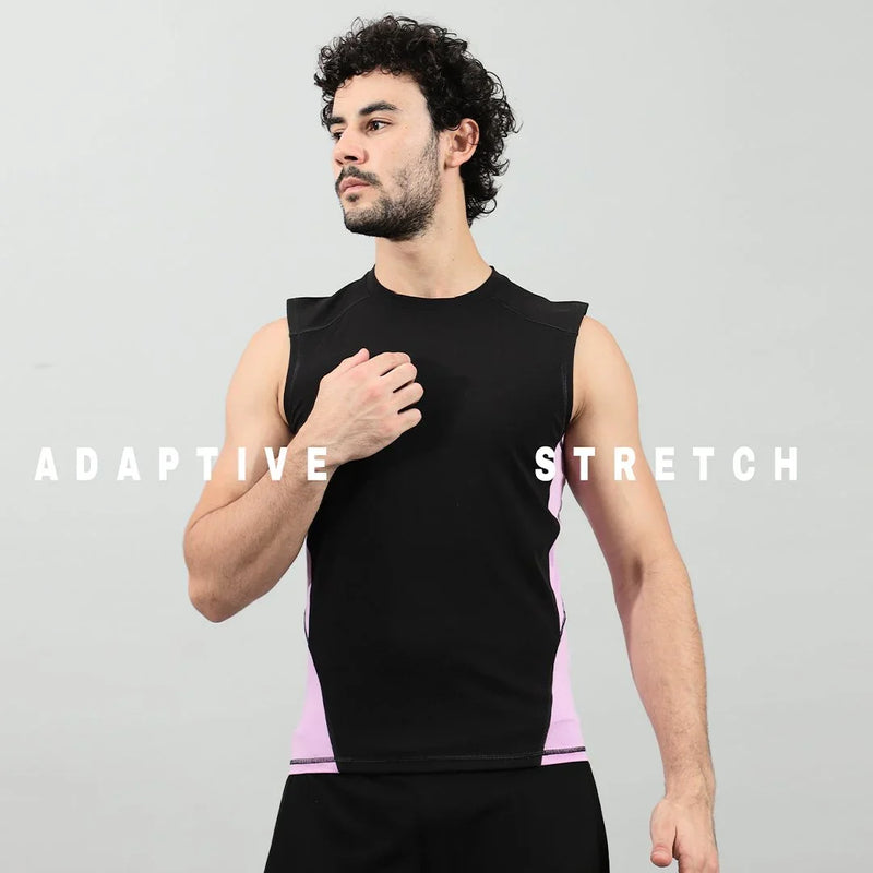 Man wearing a black and pink sleeveless adaptive stretch athletic compression shirt.