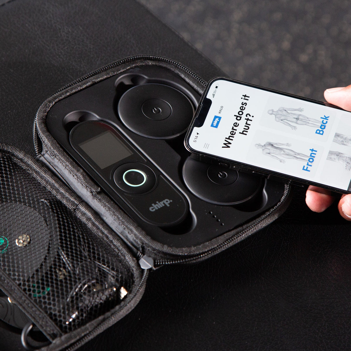 Chirp Halo in its charging case with the Halo pad placement app