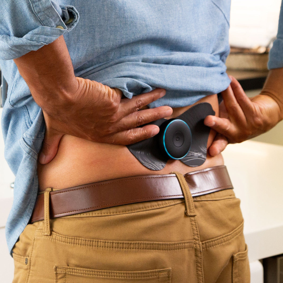 Man using the Chirp Halo with a lower back pad for back recovery
