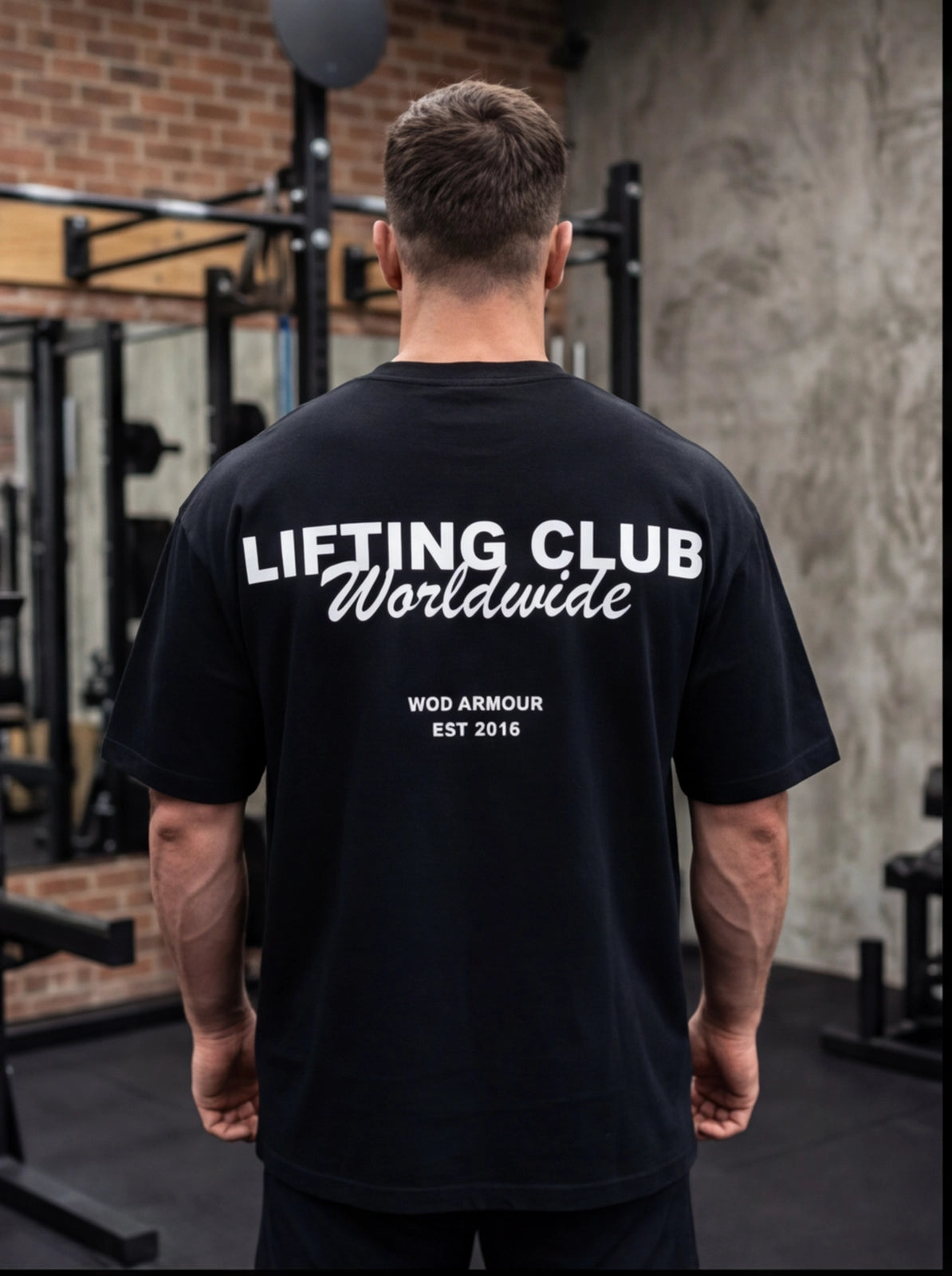 Man wearing black 'Lifting Club Worldwide' gym t-shirt, functional fitness apparel for athletes