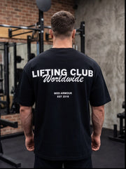 Man wearing black 'Lifting Club Worldwide' gym t-shirt, functional fitness apparel for athletes