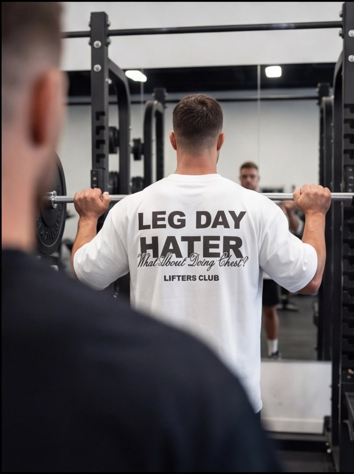 Man lifting barbell in gym wearing 'Leg Day Hater' workout shirt for lifters club