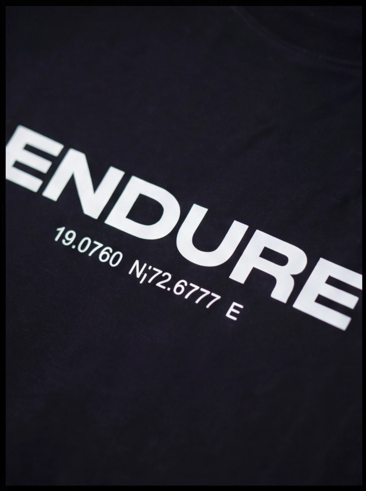 Black athletic tee with bold 'ENDURE' print and coordinates, ideal for functional fitness training.