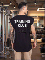 Man wearing black Training Club sleeveless gym shirt with motivational text, in fitness studio