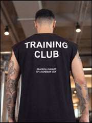 Man wearing black sleeveless Training Club gym shirt with motivational text, showcasing athletic fit for functional fitness.
