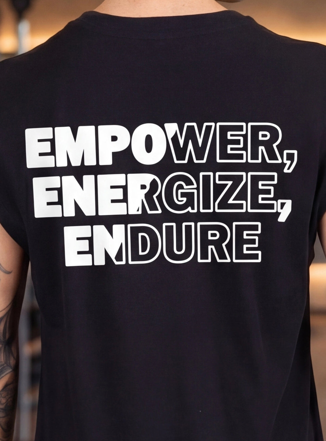 Black fitness t-shirt with bold white text: Empower, Energize, Endure for athletic performance and endurance training