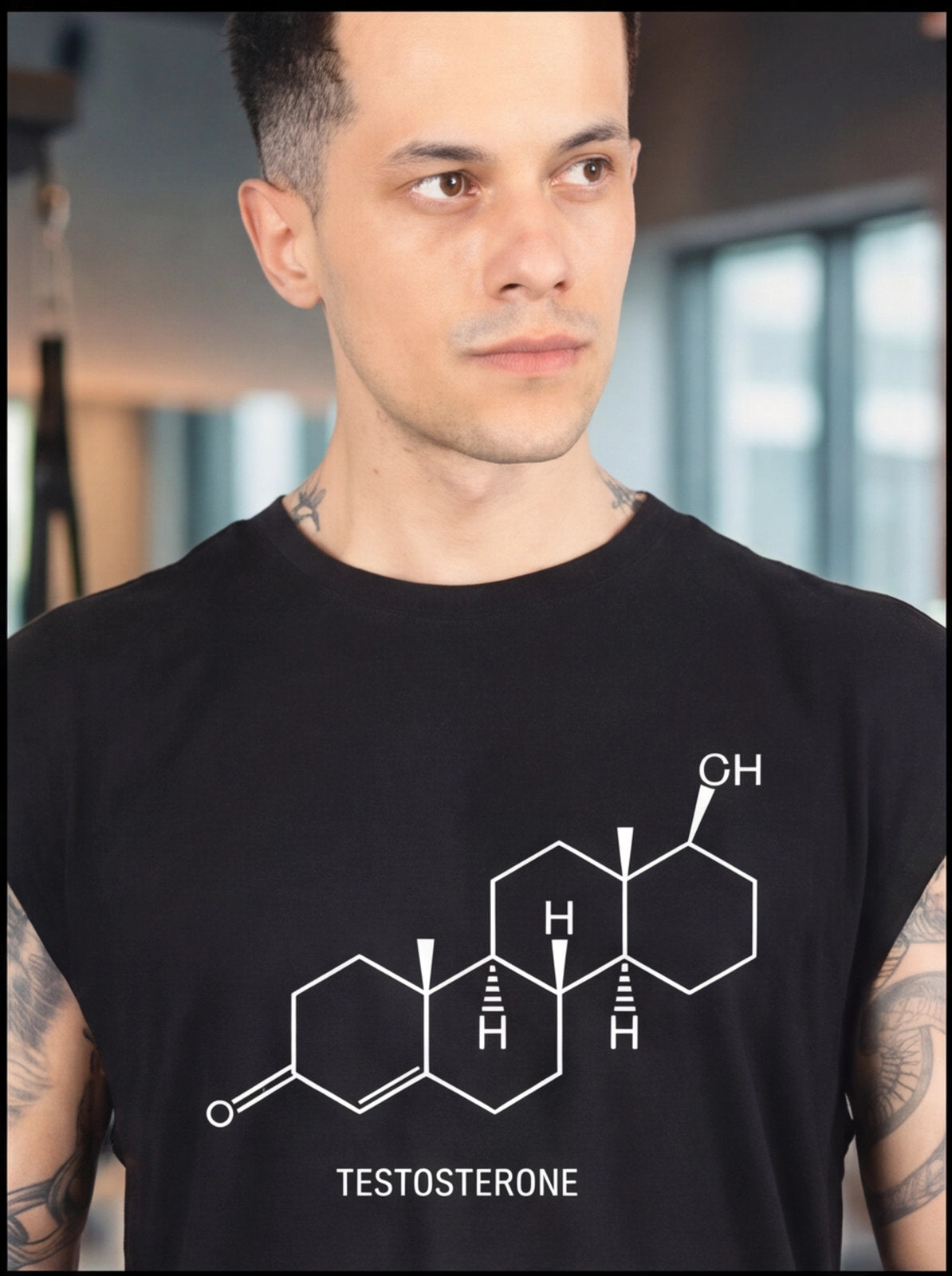 Man wearing black testosterone molecule graphic tee, fitness apparel for athletes