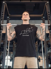 Man in gym wearing black testosterone molecule graphic tee during barbell workout