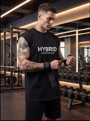 Athlete in HYBRID ATHLETES CLUB sleeveless shirt wrapping wrist wraps in gym, functional fitness gear