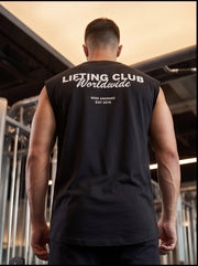 Man wearing black sleeveless gym shirt with 'LIFTING CLUB Worldwide' text, ideal for functional fitness training.