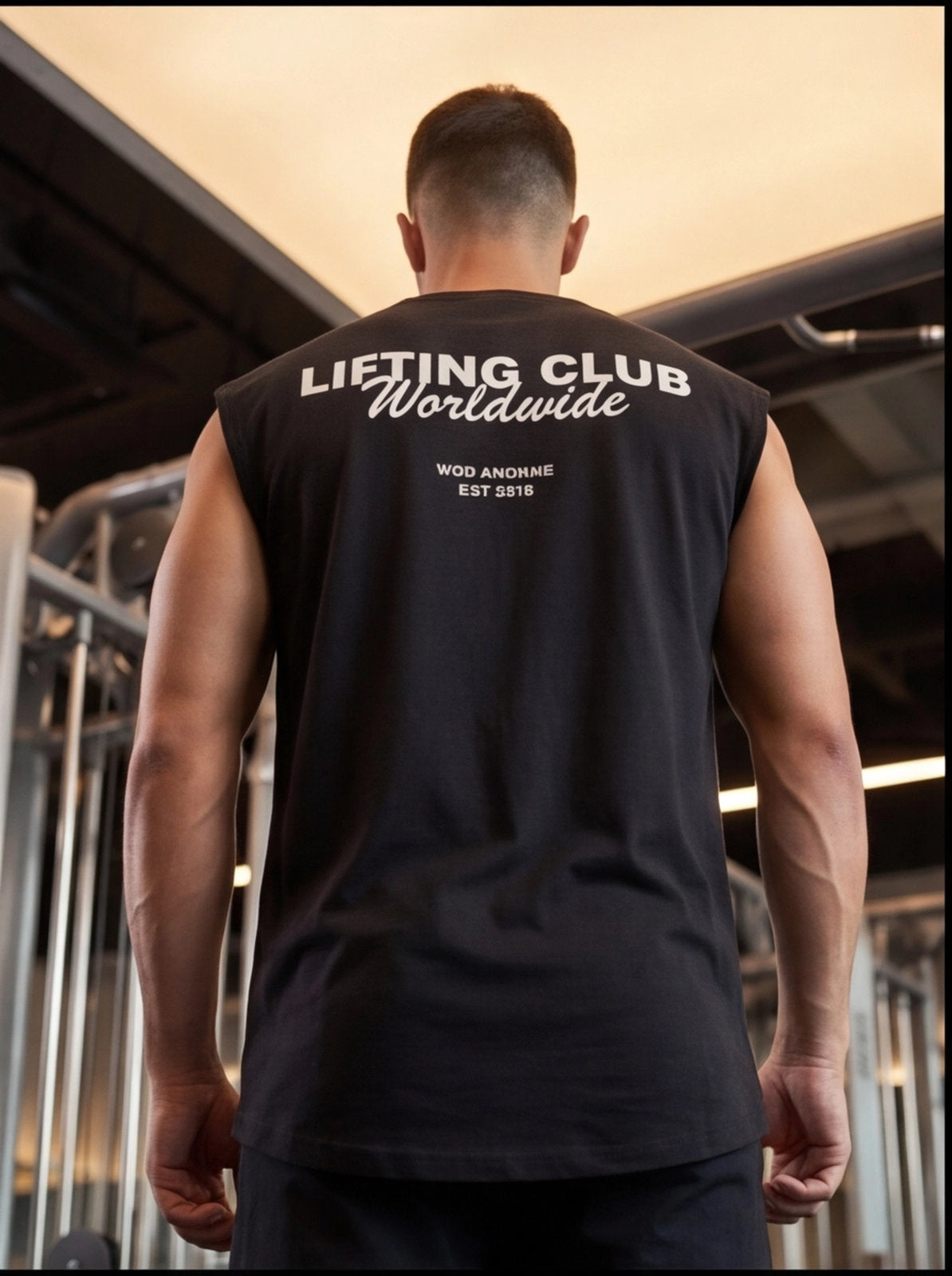Man wearing black sleeveless gym shirt with 'LIFTING CLUB Worldwide' text, ideal for functional fitness training.