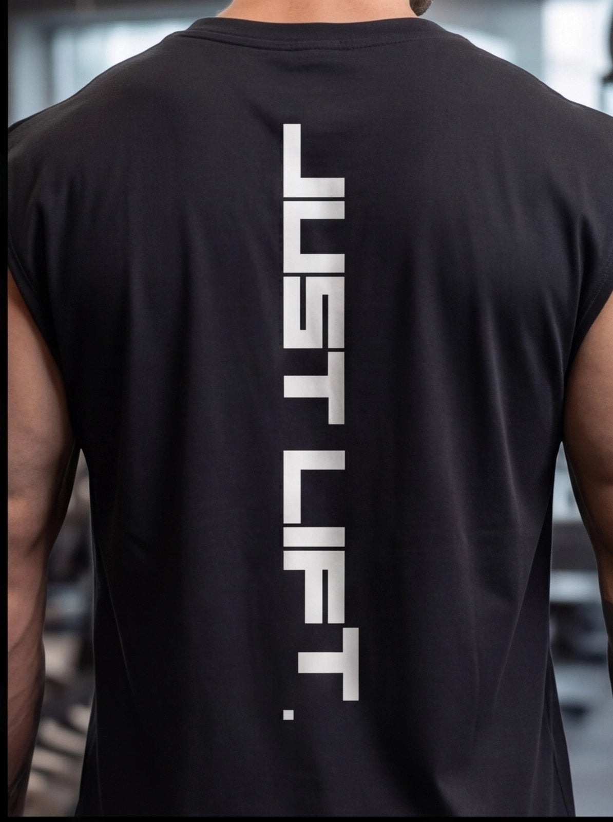Black sleeveless gym shirt with 'JUST LIFT' vertical text, worn by athlete for functional fitness training.