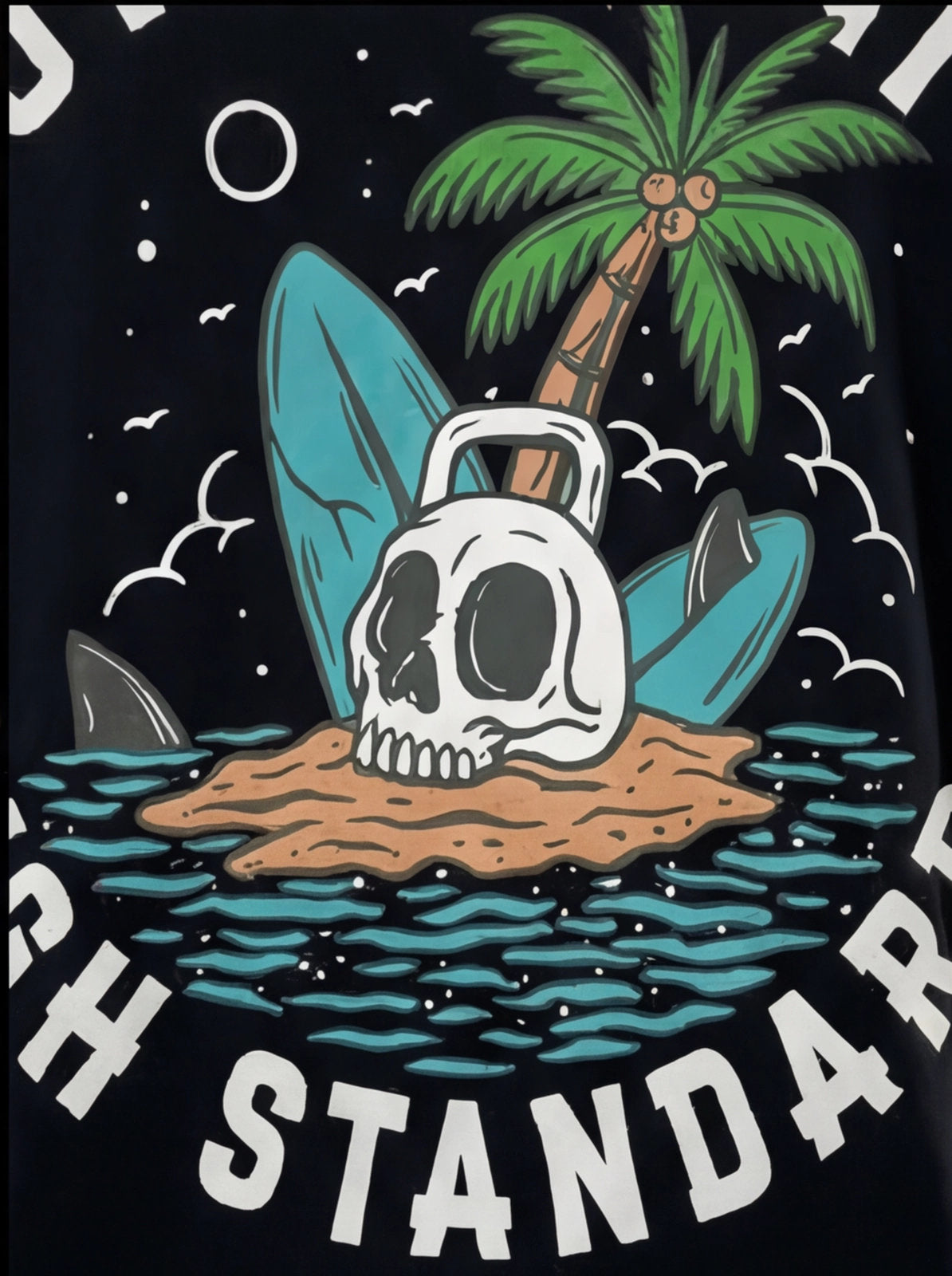 Skull with kettlebell on island, palm tree, surfboards, shark fin — fitness apparel graphic design