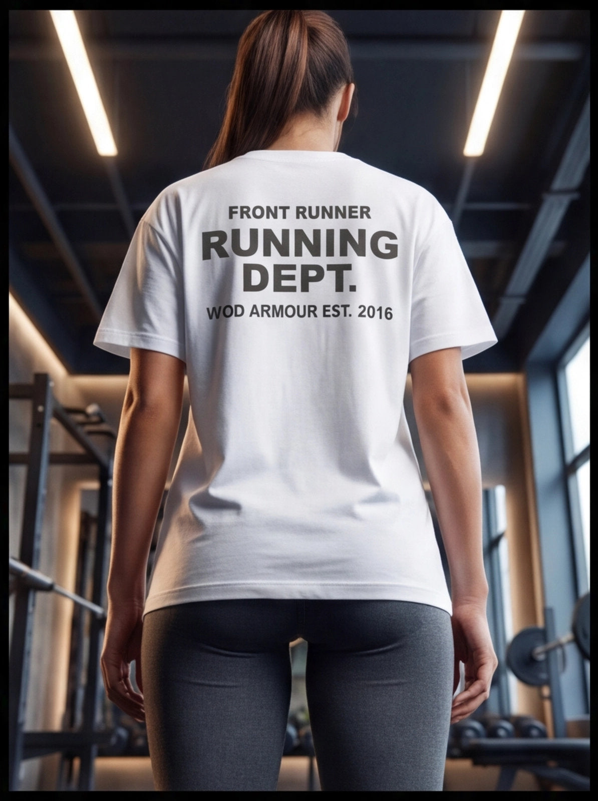 Woman wearing white 'Front Runner Running Dept.' gym t-shirt, fitness apparel for athletes in gym setting