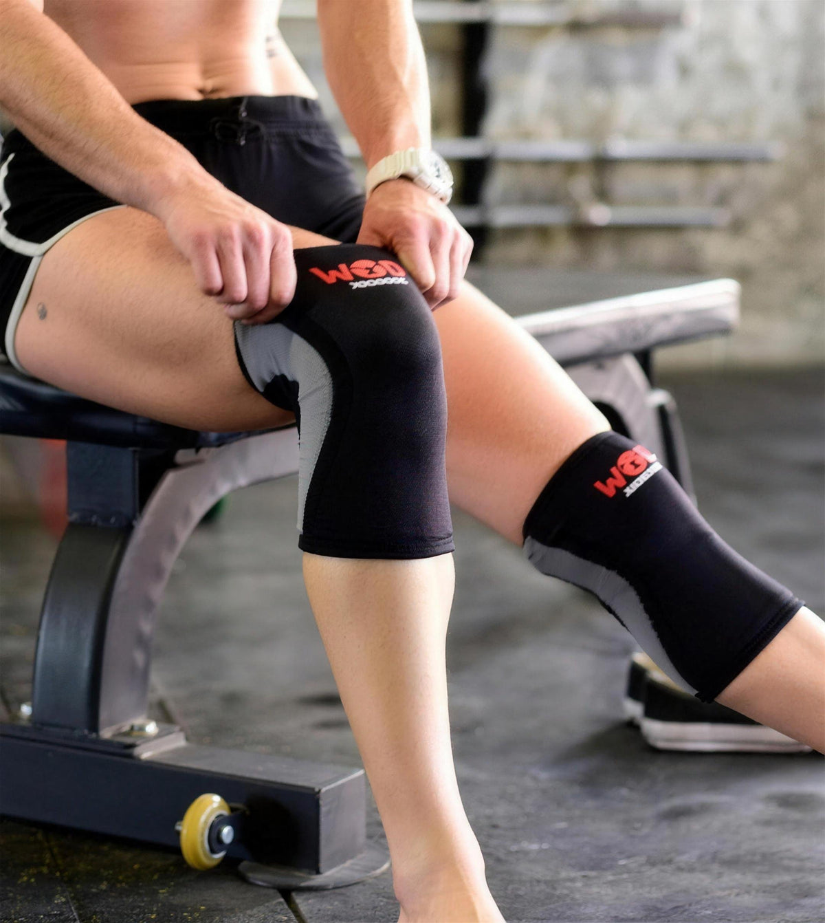 Athlete wearing black WOD Armour knee sleeves for joint support and injury prevention.