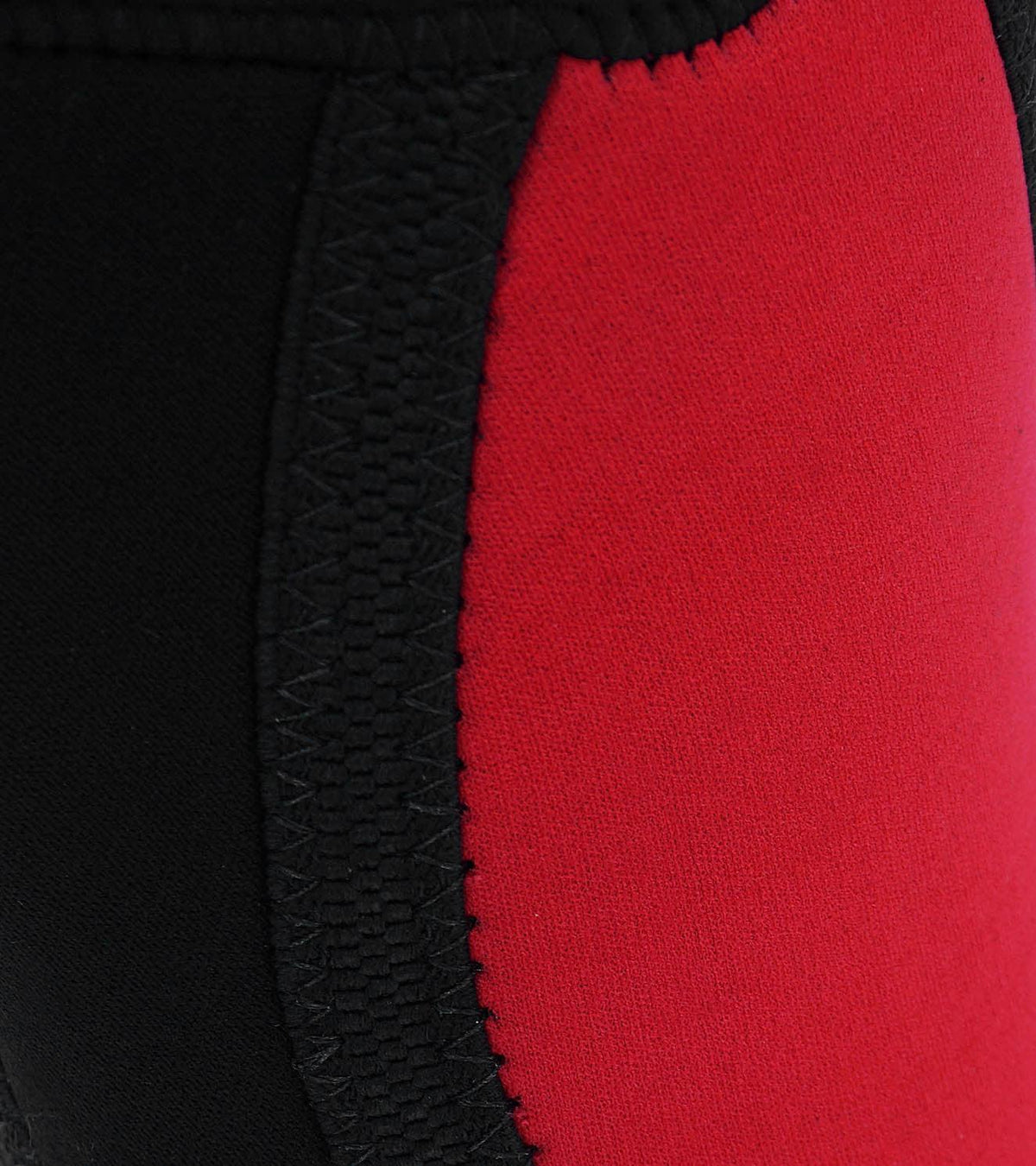 Close-up of black and red athletic gear featuring reinforced stitching.